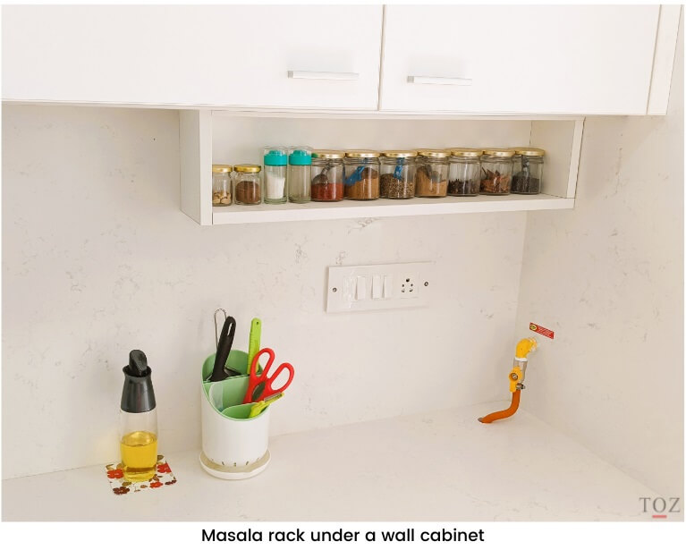Masala rack under a wall cabinet