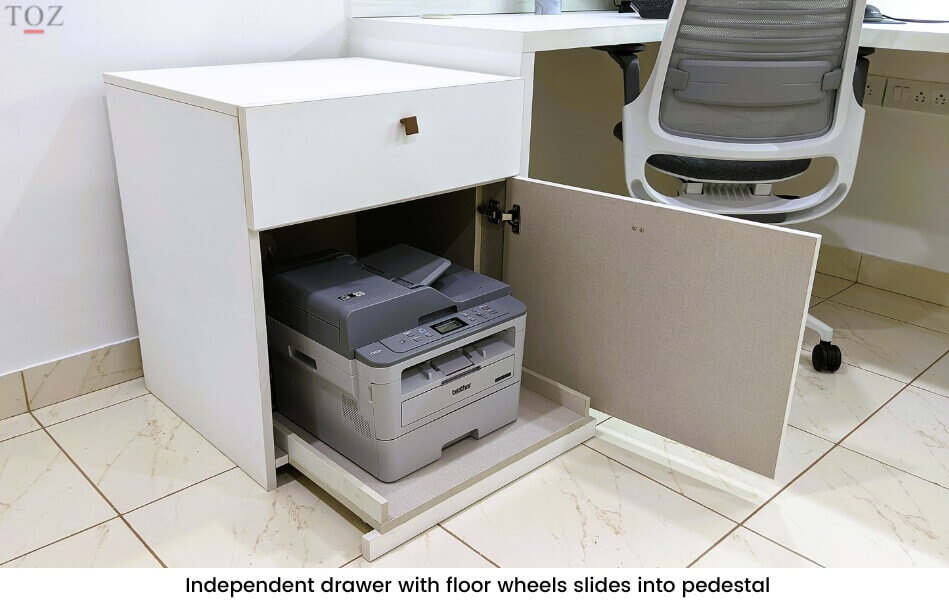 Independent drawer with floor wheels slides into pedestal of home office