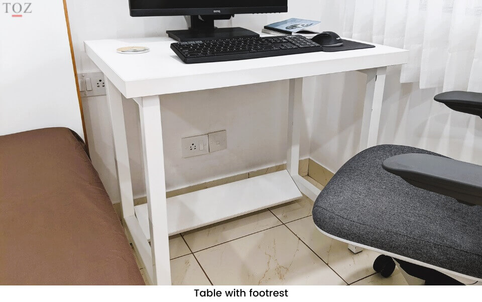 Workspace table with footrest